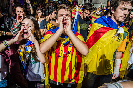 Some young people shouting slogans during the march of the manifestation. Thousands of students have rallied in support of the Declaration of independence and the Catalan Republic in Barcelona. During the demonstration the political events and statements of President Puigdemont have been following. At noon was published in the media that the choice made by the President Puigdemont was to convene autonomous elections, leaving aside the Unilateral Independence Declaration. Finally the President Puigdemont postponed such a statement.