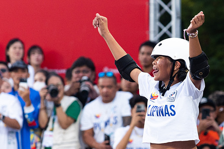 Mazel Paris Alegado from Philippines celebrates during the Women's park skateboarding finals round in 33rd SEA Games at SAT Extreme Sport Park.