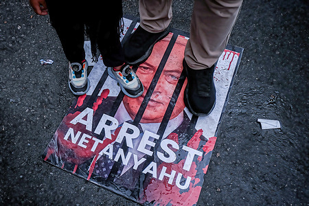 Several rally participants seen stepping on posters depicting the Prime Minister of Israel, Benjamin Netanyahu during the Stand for SUMUD rally. Protesters demonstrated outside the US Embassy, condemning the Israeli military for blocking and detaining volunteers of the Sumud Flotilla humanitarian mission after it entered the yellow zone near Gaza yesterday.