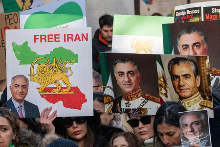 A large pro-Irania regime change demonstration, of approximately 1000 people, supporting ongoing anti-regime protests within Iran. Many participants held portraits of Mohammad Reza Pahlavi, the exiled son of Iran’s last Shah. The protest included individuals lying in body bags and individuals made up with apparent injuries. Central library in St Peter’s Square, Manchester UK Picture: garyrobertsphotography Free Iran sign with pictures of Mohammad Reza Pahlavi.