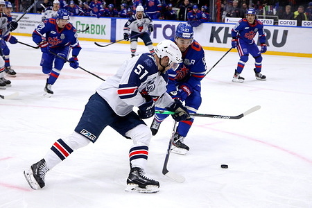 SKA Hockey Club player, Igor Ozhiganov (No.27) and Torpedo Hockey Club player, Nikola Kovalenko (No.51) seen in action during the Kontinental Hockey League, Gagarin Cup, match 2, 1/2 finals of the Western Conference season KHL 2022 - 2023 between SKA Saint Petersburg and Torpedo Nizhny Novgorod at the Ice Sports Palace.
(Final score; SKA Saint Petersburg 5:4 Torpedo Nizhny Novgorod)