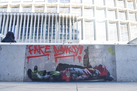 'Fake Banksy' graffiti covers the protective screen on the artwork outside Centre Point, believed to be by Banksy. An identical artwork in Bayswater was confirmed by Banksy, but not this one. The elusive street artist's identity has now reportedly been uncovered and could be Robin Gunningham, who changed his name to David Jones, according to an investigation by Reuters.