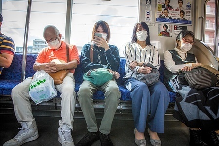 Subway passengers wear face masks as a preventive measure during the lifting of the state of emergency.Japan has lifted a state of emergency imposed due to the coronavirus in 39 out of 47 prefectures, after a sharp fall in new infections.