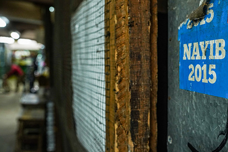 View of a 2015 Nayib Bukele Mayor campaign sticker at a market in San Salvador. The Bukele administration has ended its fourth year in office ahead of a questioned re-election bid. The country has been placed under an ongoing state of emergency to combat gangs that have been in place for 14 months, leaving more than 68 thousand alleged gang members arrested. In the last year, the country hit some of its highest inflation numbers ever and was close to default, as the country has little liquidity, continuing with its push for Bitcoin, a deal with the IMF was not reached.