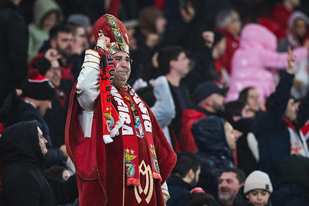 SL Benfica fan dressed as a Bishop cries with emotion after SL Benfica's victory at the UEFA Champions League 2025/26 League Phase MD8 match between SL Benfica and Real Madrid CF at Estadio da Luz.