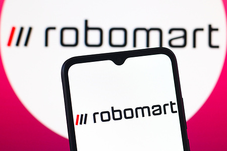 In this photo illustration, the Robomart logo is seen displayed on a smartphone screen.