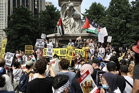 Protesters gather at Columbus Circle during the demonstration. Hundreds of demonstrators gathered in Manhattan, New York to voice their opposition to the airstrikes which targeted three nuclear facilities across Iran, between June 21 and 22.