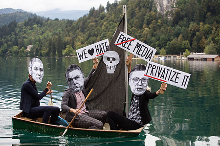 A group of protesters wearing paper masks showing the faces of Slovenian Prime Minister, Janez Jansa, Hungarian Prime Minister, Viktor Orban and Serbian president, Aleksandar Vucic row a small sailboat on Lake Bled protesting against their politics and the rise of fascism in Europe.
The protest was held alongside the 15th Bled Strategic Forum where Slovenian Prime Minister Janez Jansa hosted the Hungarian Prime Minister Viktor Orban and Serbian president Aleksandar Vucic, as well as prime ministers of Czech Republic, Bulgaria, Poland, Croatia and others.