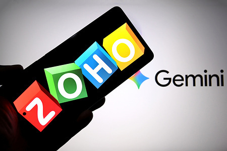 In this photo illustration, a ZOHO logo is seen displayed on a smartphone with a Gemini AI logo in the background.