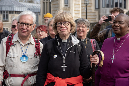 The Archbishop of Canterbury, Sarah Mullally (C) and her husband Eamonn Mullally (L) and the Suffragan Bishop of Dover, Rose Hudson-Wilkin (R) listen speeches on the end of the pilgrimage outside the Canterbury Cathedral. Archbishop Sarah Mullally walked the 87-mile (140 km's) route along the Becket Camino, accompanied by her husband, Eamonn Mullally. It took 6-days for them and the fellow pilgrims to walk from the St Paul's Cathedral to the Canterbury Cathedral.