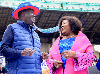 The Azimio la Umoja One Kenya flag bearer Raila Odinga (L) and his wife Ida Odinga gesture during the coalitions final rally at Kasarani Stadium. The Azimio La Umoja One Kenya Final Rally was held At Moi International Stadium-Kasarani.