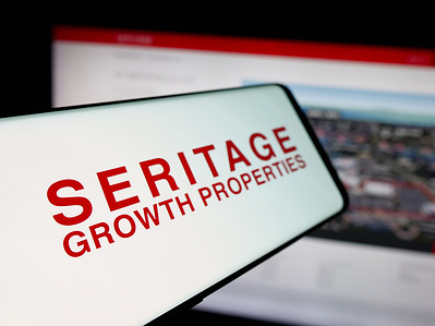 In this photo illustration, a smartphone with the logo of US REIT company Seritage Growth Properties is seen on screen in front of website.