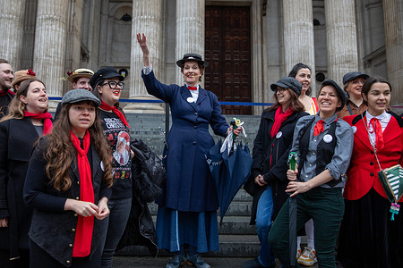 Dick Van Dyke fans perform a song during the celebrations of the American actor's 100th birthday in London. Fans of Dick Van Dyke gathered outside St Paul's Cathedral in London at noon, dressed as Mary Poppins characters, to celebrate the American actor's 100th birthday with songs and dances.