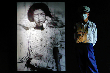 A photograph of 10-year-old Yukiko Fujii, taken after the atomic bombing seen displayed at the entrance of the Hiroshima Peace Memorial Museum. A photograph of a young girl taken on August 9,1945 three days after the atomic bombing is seen displayed at the entrance of the main building of the Hiroshima Peace Memorial Museum. Yukiko Fujii, who was 10 years old at the time and later died at the age of 42 suffered severe burns to her right arm. Her expression conveys the deep pain and sorrow of the moment. The Japanese government has recommended for UNESCO’s “Memory of the World” program a collection of photographs and film documenting the devastation following the atomic bombing. Among them is the image of Yukiko Fujii taken by the late Yukio Kunihira, a photographer for the Mainichi Newspapers.