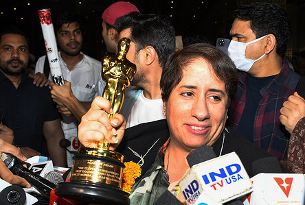 Bollywood producer Guneet Monga holding the Academy Award trophy interacts with the media at Chhatrapati Shivaji Maharaj International Airport (CSMIA) in Mumbai. Indian film producer Guneet Monga won the Academy Award for the Best Documentary Short Film 'The Elephant Whisperers' in Los Angeles.