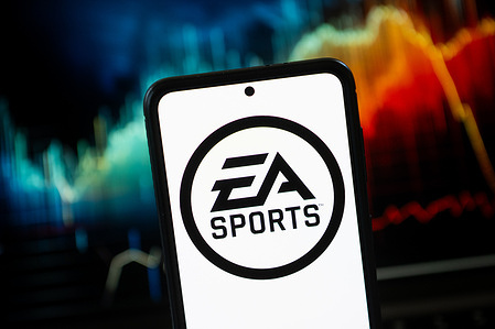 In this photo illustration a EA Sports logo seen displayed on a smartphone.