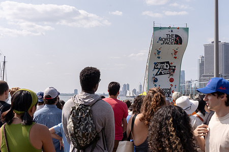 Spectators watch a knockout heat during the North Face Climb Festival at Brooklyn Bridge Park’s Pier 5 in New York City. The North Face company held a Climb Festival at Brooklyn Bridge Park