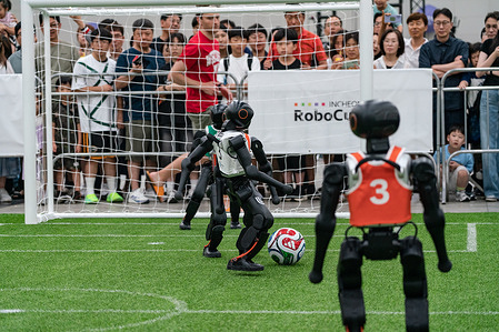 Humanoid robots seen playing soccer for the Humanoid soccer league at Songdo ConvensiA. RoboCup 2026 INCHEON is happening from July 2 to July 6 at Songdo ConvensiA. The event was first held in 1997 and is the world’s largest robot soccer competition and a global challenge dedicated to build a better future through artificial intelligence and robotic technologies.