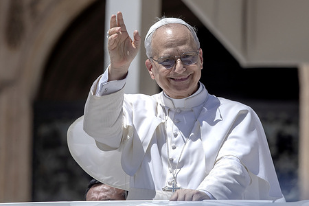 Pope Leo XIV waves as he leaves during the end of his weekly general audience in st. Peter's square.