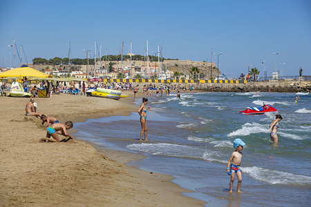 Kids are seen playing at Rethymno beach in Crete, Greece.