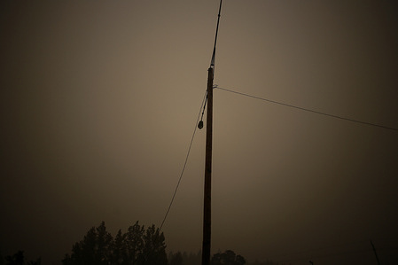 A light pole is surrounded by smoke from the wildfires.
Wild Fires in Colton, Oregon rage on as firefighters attempt to quell the fires and locals attempt to decipher whether or not the fires were started naturally or by arsonists.