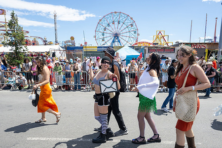 Revelers participate in the annual Mermaid Parade on Surf Ave at Coney Island in the Brooklyn borough of New York City.