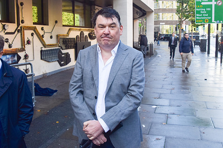 Graham Linehan arrives at Westminster Magistrates Court for his trial. The comedy writer, best known for TV shows Father Ted and The IT Crowd, is accused of harassing a transgender woman and damaging her phone.