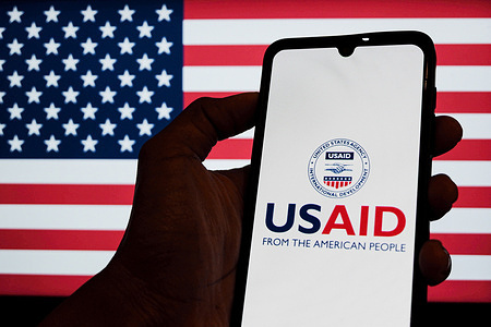 In this photo illustration, the United States Agency for International Development (USAID) logo seen displayed on a smartphone.