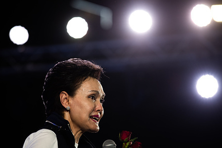 Thailand's caretaker Minister of Commerce Suphajee Suthumpun speaks during the election campaign rally of the Bhumjaithai party at Lumpini Park.
