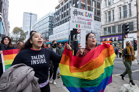 Protestors seen marching along Oxford street with a rainbow flag, a placard that reads '#DDL Zan we are ashamed from London to Rome' during the protest.
Organised by Wake Up Italia, Italians in London marched along Oxford Street to protest against the recent rejection of the DDL Zan Bill by the Italian government. The Bill seeks to protect trans and queer rights by imposing punishment on discrimination and anti-homophobia behaviour.