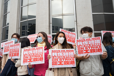 Medical staff holding placards during the strike at the Hospital Authority building.
Thousands of medical staffs took part in a industrial strike to demand the Hong Kong government to close all the border crossing with Mainland China to protect Hong Kong from the Coronavirus being spread from Mainland China.