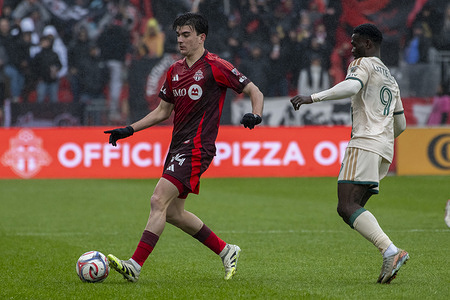 Alonso Coello #14 (L) of Toronto FC and Emmanuel Latte Lath #9 (R) of Atlanta United in action during the MLS game between Toronto FC and Atlanta United at BMO field. The game ended 2-1 for Atlanta United.