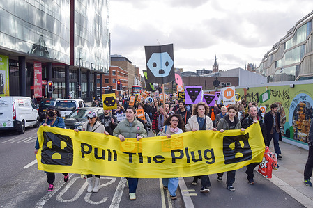 Protesters march with a 'Pull the plug' banner in King's Cross towards Meta offices during a demonstration against unregulated Artificial Intelligence (AI) and data centres.