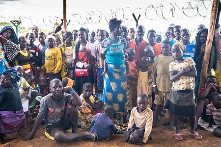Newly arrived Congolese refugees seen waiting to be registered at the Kyangwali refugee camp.
According to the UNHCR over 85,000 people have reached Uganda from the Democratic Republic of Congo since the beginning of 2018 as they escape violence in the Ituri province in north eastern part of their war torn country. The majority of refugees are arriving by boat across Lake Albert, which lies between the two countries. With refugee settlements in Uganda almost at maximum capacity there are plans for new settlements to be built to deal with the continuing influx of people.