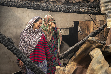 Kashmiri women react in their house damaged by cross-border shelling in Salamabad village, near the Line of Control Uri. India and Pakistan have entered their deadliest clash in over 20 years, following India's Operation Sindoor missile strikes. Ongoing cross-border shelling has killed at least 36 civilians on both sides, injured dozens, and forced families near the border to live in fear.