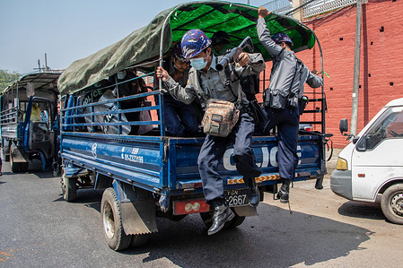 Riot Police jump out of the police truck to intervene between the military supporters and anti coup protesters.
Myanmar's military detained State Counsellor of Myanmar Aung San Suu Kyi and declared a state of emergency while seizing the power in the country for a year after losing the election against the National League for Democracy (NLD).
