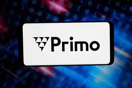 In this photo illustration, the French IT platform company Primo logo is seen displayed on a smartphone in front of abstract background on computer screen.