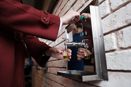 People taste olive oil from the world's first olive oil fountain during its opening. A symbolic olive oil fountain was opened for World Olive Tree Day, celebrated on or around November 26th as recognized by UNESCO. The temporary installation served as a central attraction at a local festival in an olive-producing region, offering tastings of three locally sourced extra virgin olive oils. The event aimed to promote oleotourism and highlight the cultural significance and unique flavor profiles of the region’s olive products.