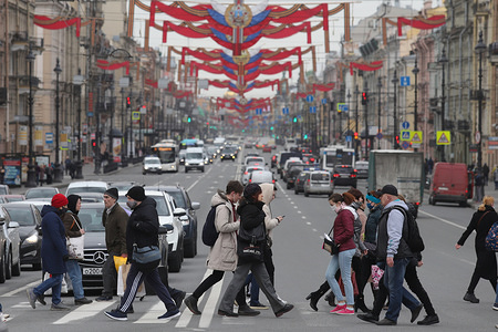 People cross Nevsky Prospect during the covid 19 pandemic.
Russian President, Vladimir Putin extends off-work days till 11 May as at least 93 558 confirmed cases and 867 death by the corona virus disease have been recorded in Russia.
