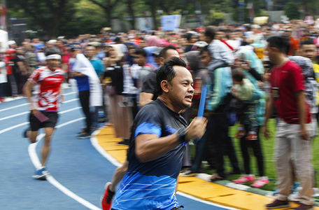 Mayor of Bogor, Bima Arya (C) relay run on the jogging track. The Mayor hopes that with the launch of jogging track, Sempur Field can improve the spirit of community sports.