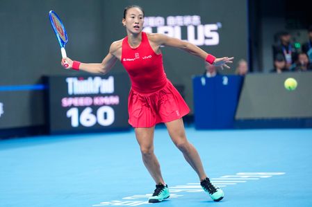 Qinwen Zheng of China seen in action with Mirra Andreeva (not in view) during the women's singles final match on day eleven of China Open at the National Tennis Center. Qinwen Zheng defeated Mirra Andreeva 7-5, 6-4