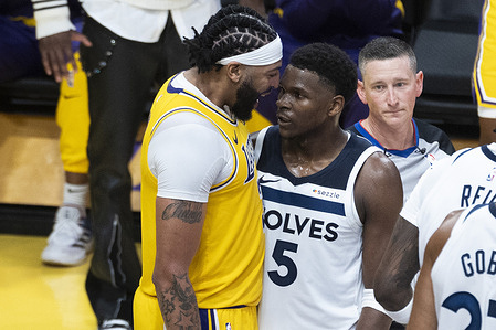 Los Angeles Lakers' Anthony Davis (L) exchanges word with Minnesota Timberwolves' Anthony Edwards (R) during an NBA basketball game at Crypto.com Arena on Tuesday, Oct. 22, 2024 in Los Angeles.