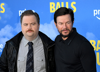 Actor Paul Walter Hauser and actor Mark Wahlberg attend Premiere Of Amazon MGM Studios "Balls Up" held at Harmony Gold Theater.