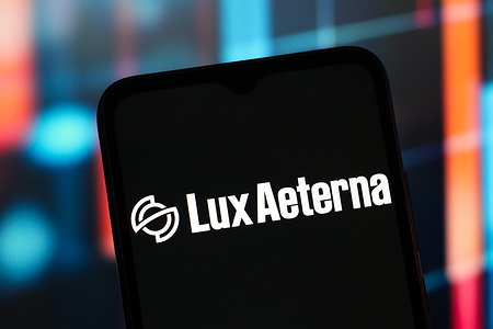 In this photo illustration, the Lux Aeterna Space logo is seen displayed on a smartphone screen.
