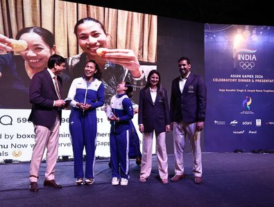 Lovlina Borgohain and Saikhom Mirabai Chanu seen presented with iPhone 18 as a gift during the celebratory function by PT Usha the President Indian Olympic Association. Lovlina Borgohain and Saikhom Mirabai Chanu secured a gold medal in the Women's 75kg boxing category putting on a masterclass performance. Together they delivered historic, podium-topping performances.