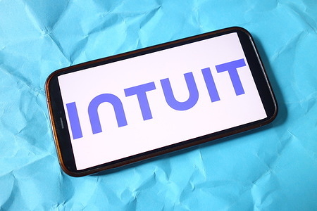 In this photo illustration, the Intuit company logo is seen displayed on a smartphone screen.