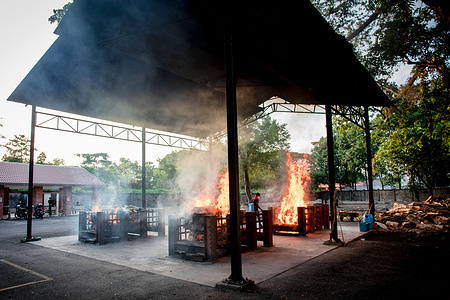 Several coffins with bodies of those who lost their lives from coronavirus Covid-19 infection are seen burning at the crematorium.Malaysia has once again recorded the highest number of Covid-19 cases with 21,668 new cases and 318 deaths.