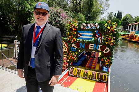 Eugenio Martínez Enríquez, Cuba's ambassador to Mexico, seen at the Xochimilco pier in Mexico City during the Festival. The event, held aboard Trajineras decorated with a multitude of Xochimilco flowers, brought together residents, visitors, and authorities to demand an end to the blockade against Cuba, part of U.S. President Donald Trump's actions against the island to prevent the Caribbean nation from accessing oil and other fuels.