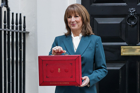 Chancellor of the Exchequer Rachel Reeves holds the red despatch box outside 11 Downing Street before leaving for the House of Commons to deliver the Budget.