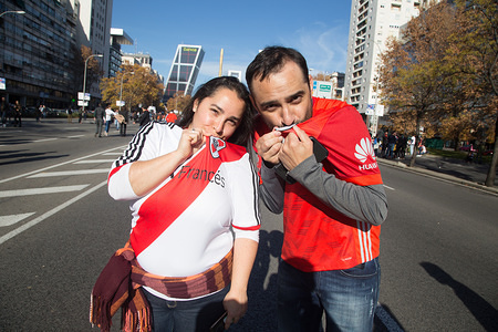 River Plate supporters seen kissing their team's shield at the fan zone.
Fans of River Plate meet in Madrid in the fan zone prior to the final match of the Copa Libertadores in Madrid.